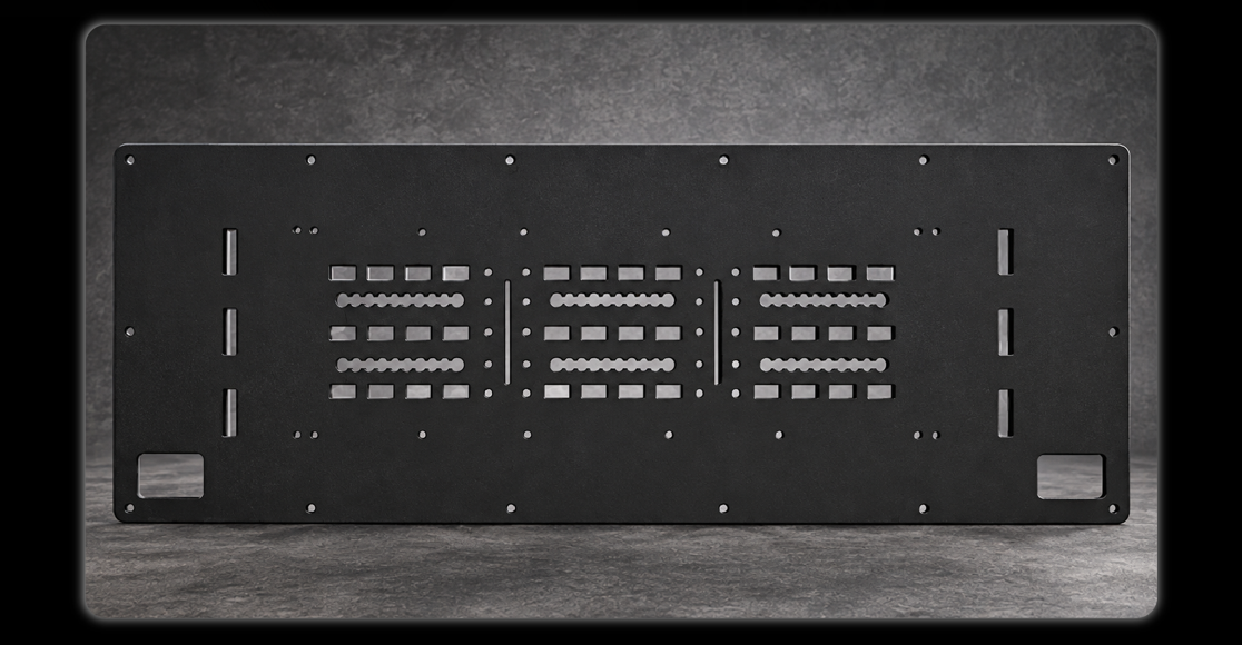 Black powder-coated MOLLE panel product shot showing rectangular slots wavy slots and mounting holes