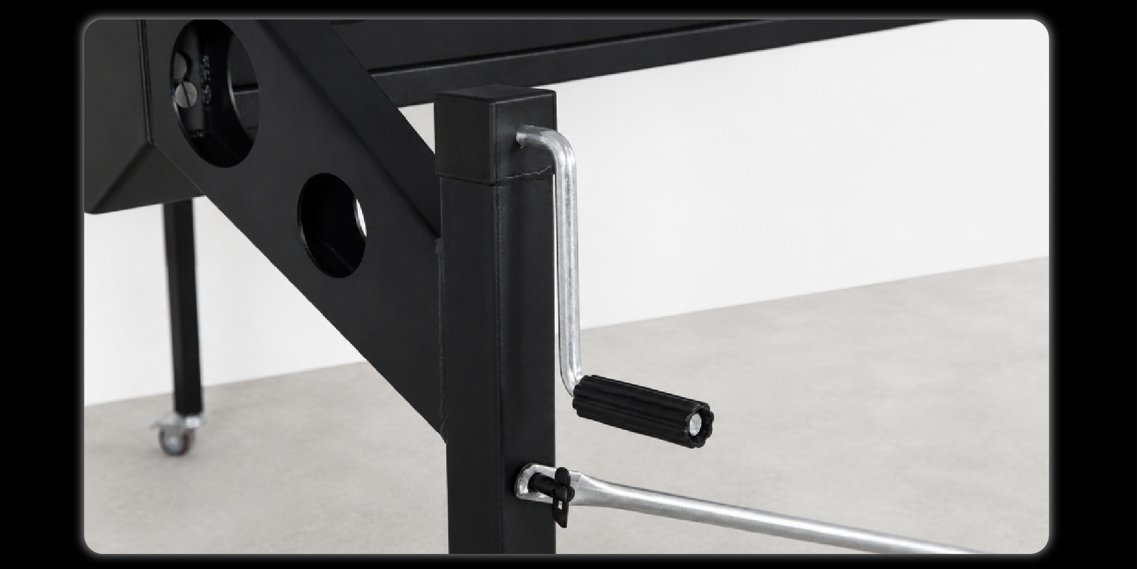 Close-up of crank handle adjustment mechanism on support leg with quick-release pin